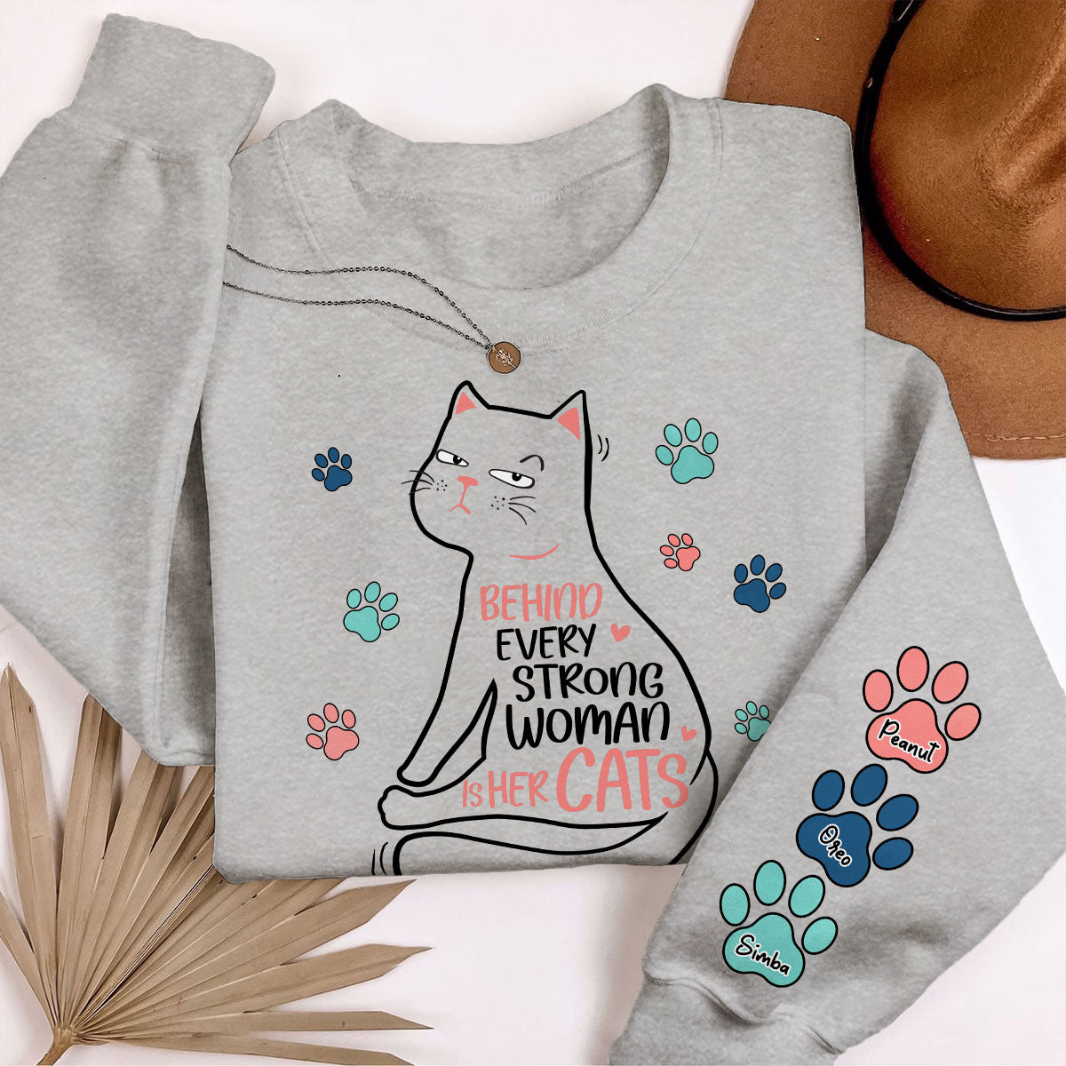 Behind Every Strong Woman Is Her Cats Personalized Sleeve Printed Sweatshirt