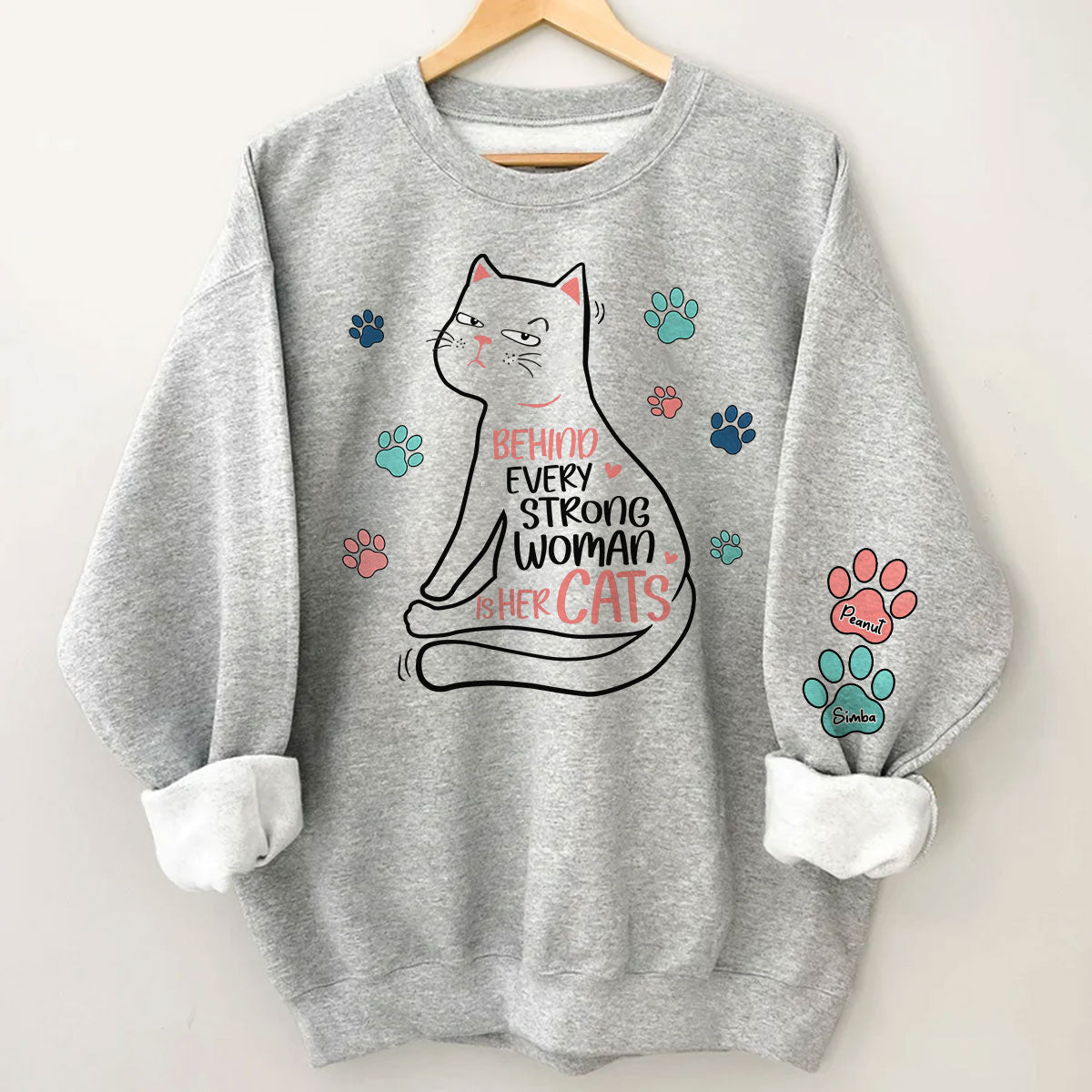 Behind Every Strong Woman Is Her Cats Personalized Sleeve Printed Sweatshirt