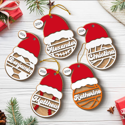 Sports Santa Hat With Name 2-Layered Wooden Ornament, Personalized Football Baseball Volleyball Basketball Soccer Ornament, Unique Christmas Gift For Kids