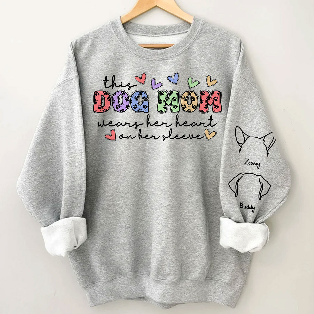 Dog Mom Colorful Paw Pattern, This Dog Mom Wears Her Heart On Her Sleeve, Custom Dog Name, Dog Mama, Personalized Sleeve Printed Sweatshirt