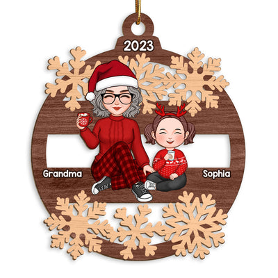 Cute Grandma And Grandkid Sitting In Snowflake Christmas Personalized Wooden Ornament